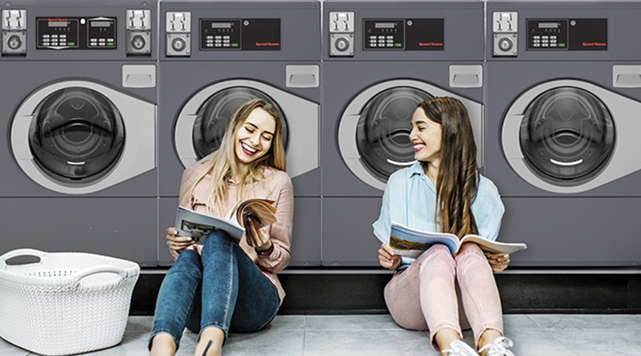 Illustration: women waiting for their wash & dry cycle completion in a Speed Queen laundry room